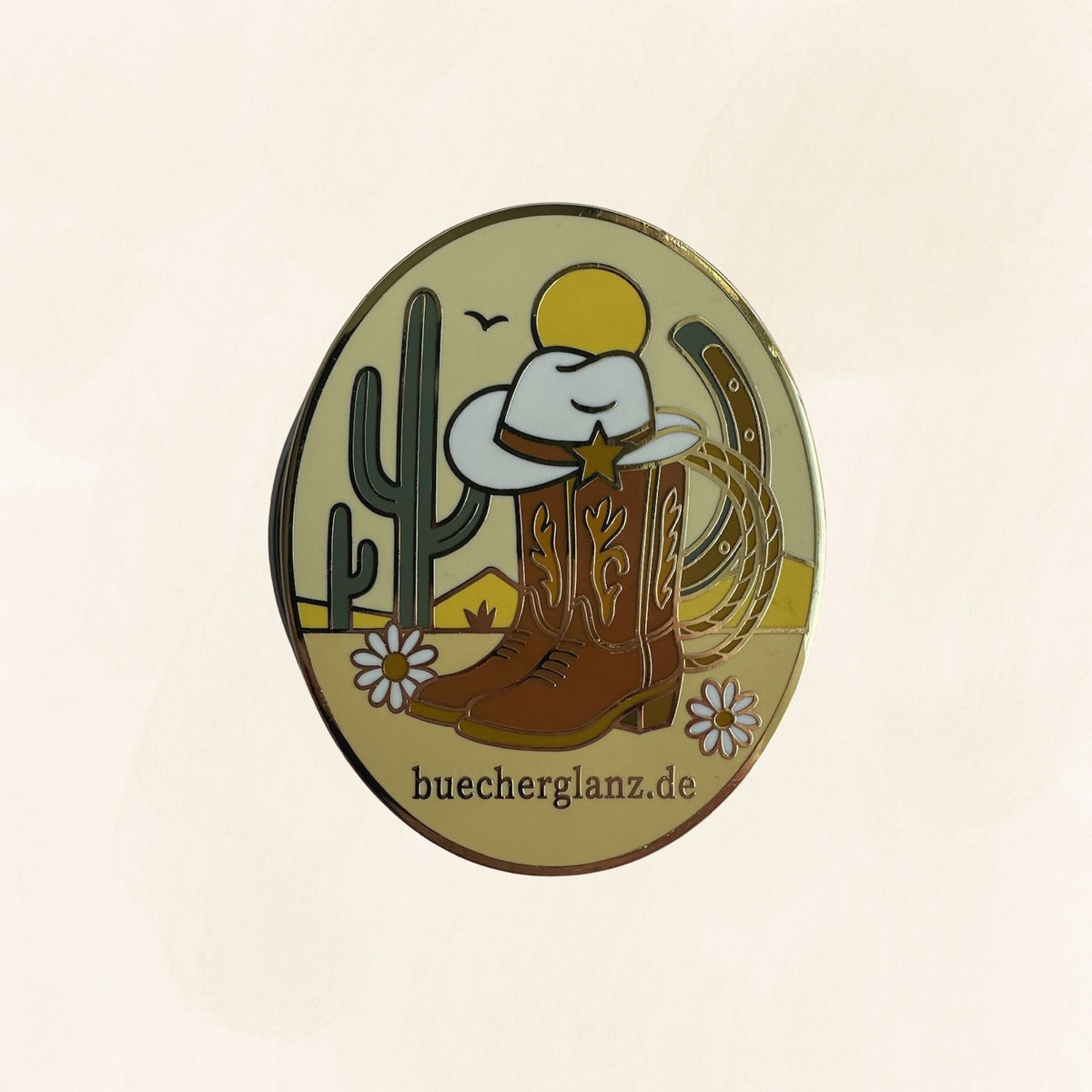 Desert Darling E-Reader Grip in Gold mit Cowboy-Stiefeln, Cowboyhut, Kaktus, Lasso und Blumen auf hellem Hintergrund