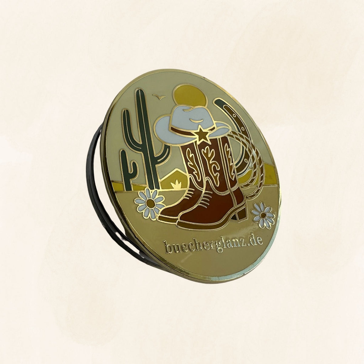 Desert Darling E-Reader Grip in Gold mit Cowboy-Stiefeln, Hut, Kaktus und Lasso auf hellem Hintergrund